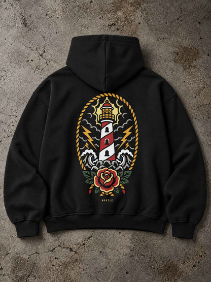 Schwarzer MORTLE Lighthouse Oversized Hoodie mit großem Leuchtturm Rückenprint im Traditional Tattoo Stil