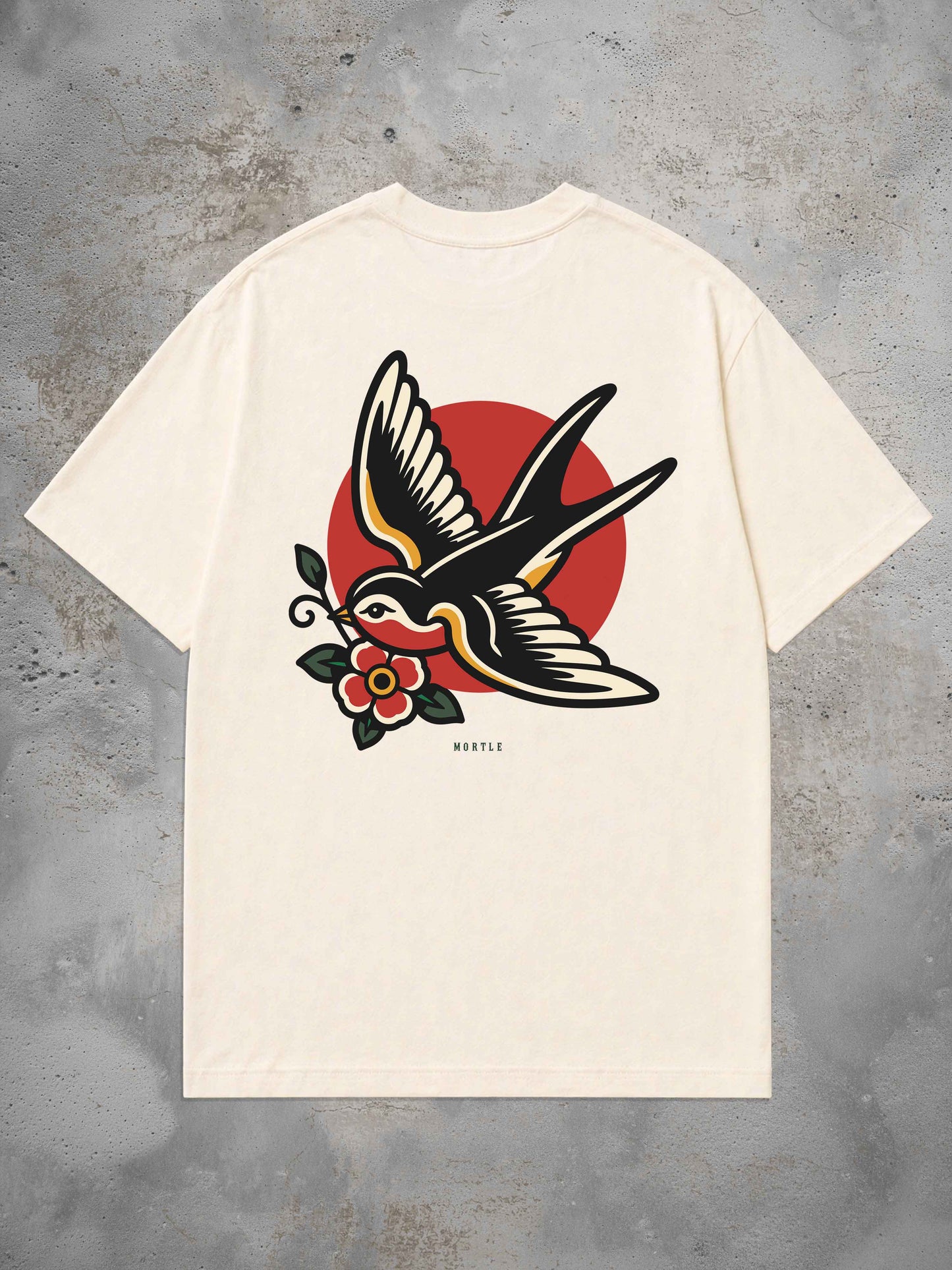 Swallow Oversized Tattoo T-Shirt by MORTLE featuring a large American Traditional swallow back print with floral detail.