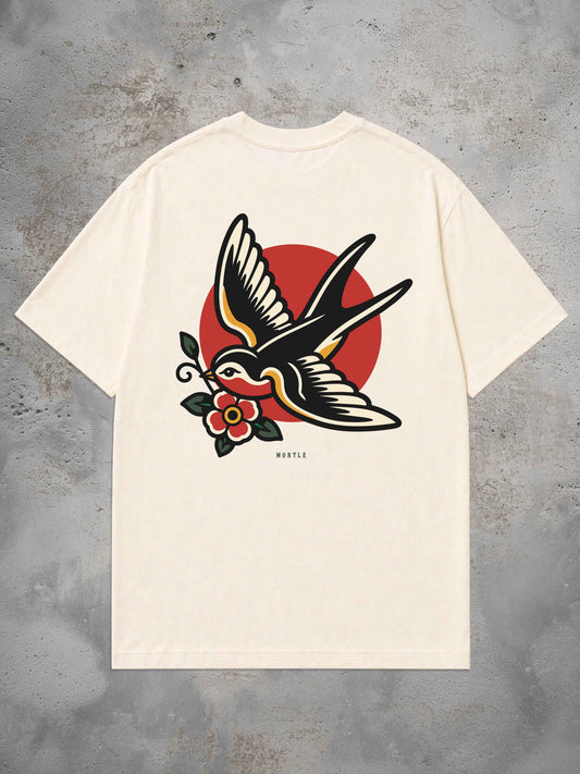 Swallow Oversized Tattoo T-Shirt by MORTLE featuring a large American Traditional swallow back print with floral detail.